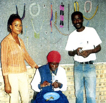 Members of the support group showing the products of their bead project