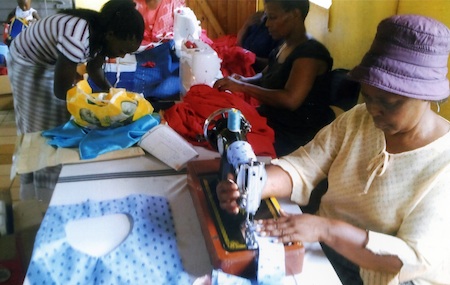 A Swazi lady sews blouses and teaches others