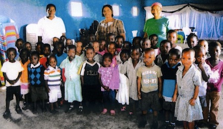Pre-school children with their two mistresses and with Mrs Busi Vilakazi